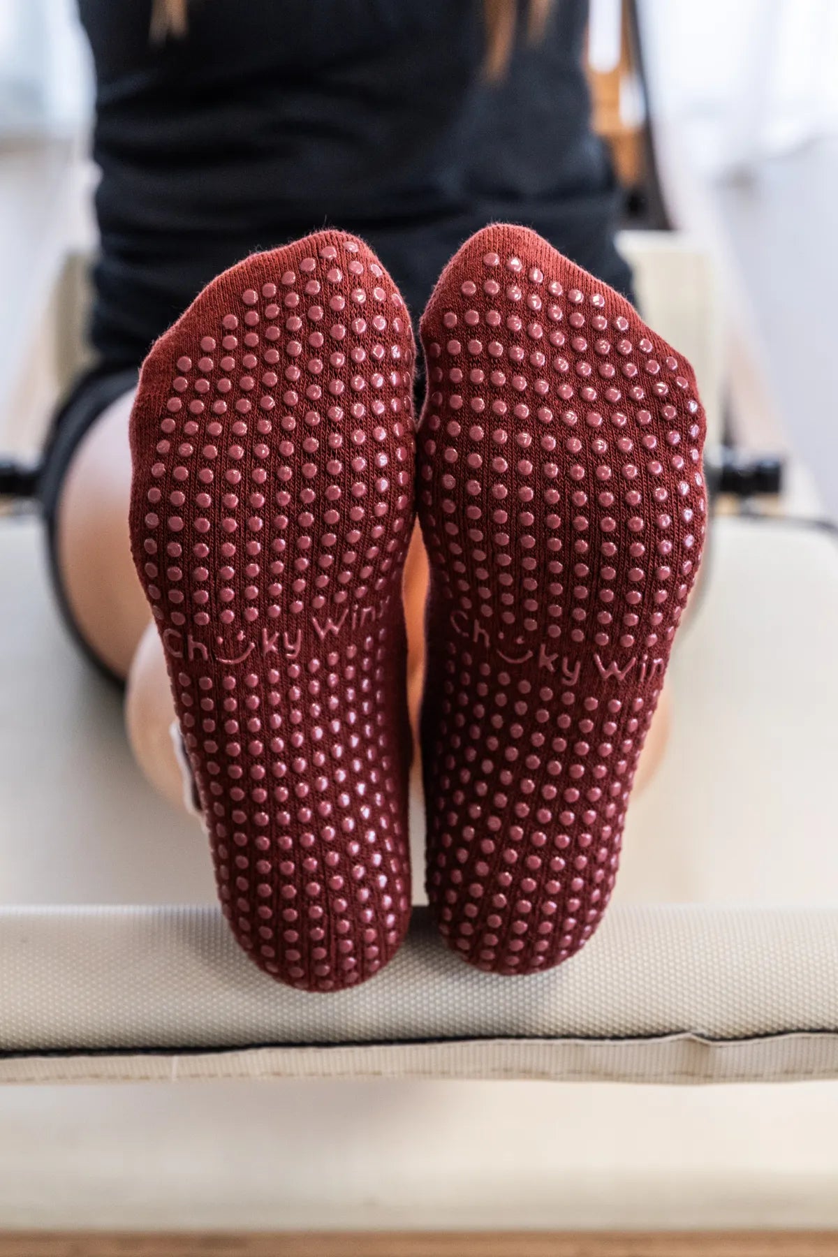Maroon frilly grip socks with decorative frill and non-slip sole for reformer, Pilates, yoga, and barre by Cheeky Winx. Australia's best grip socks.