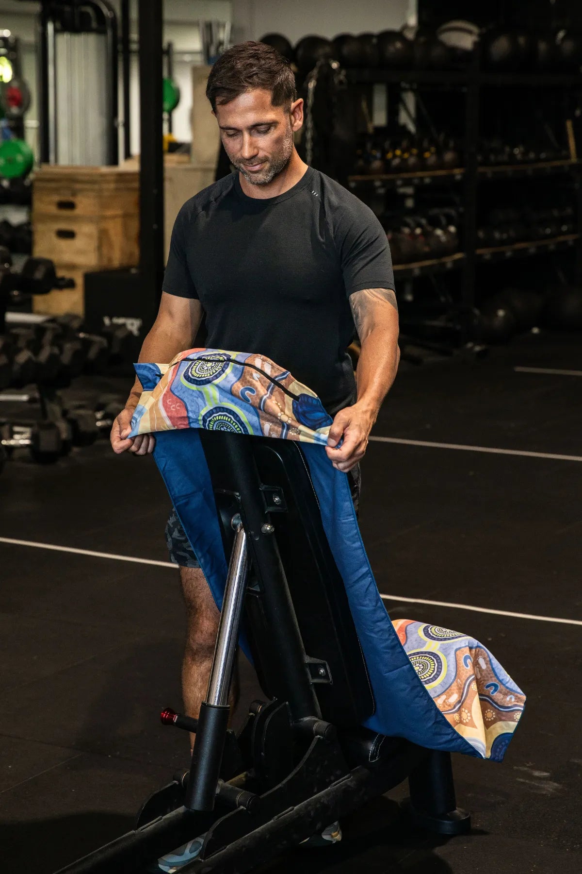 Calm Mind Indigenous hooded gym towel by Aboriginal artist Mirii Art, 140x60cm with zip pocket in hood, stays on gym bench, quick-dry and odour resistant by Cheeky Winx Australia.