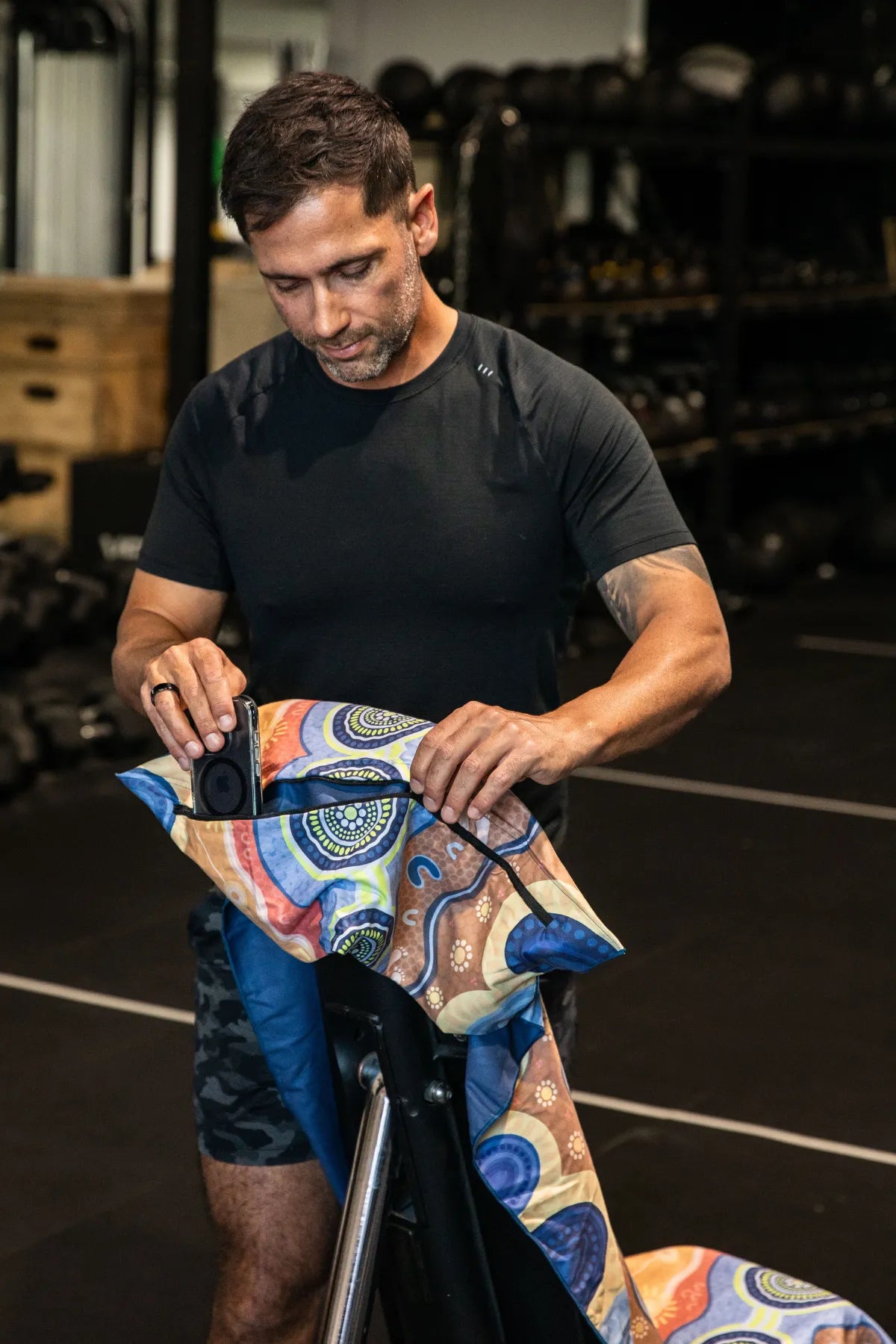 Calm Mind Indigenous hooded gym towel by Aboriginal artist Mirii Art, 140x60cm with zip pocket in hood, stays on gym bench, quick-dry and odour resistant by Cheeky Winx Australia.